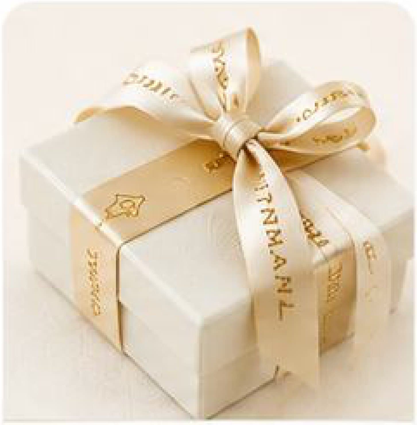 A Trimaani gift box tied with a printed ribbon